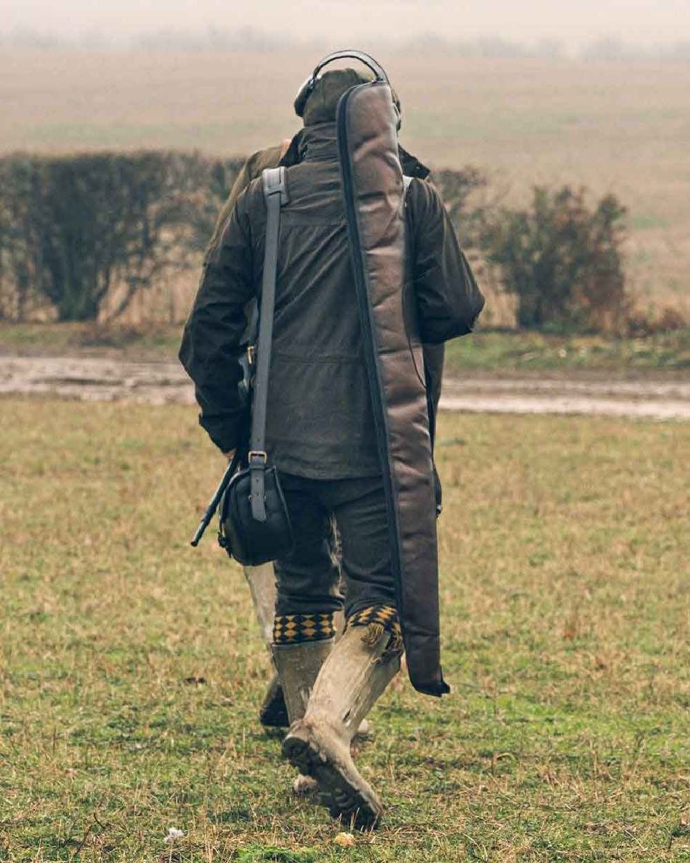 Brown coloured Jack Pyke Leather Shotgun Slip on grassy background