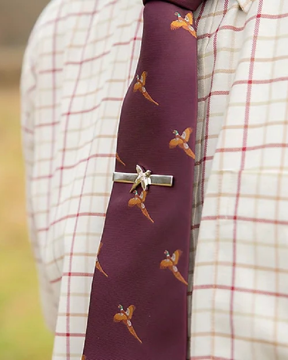 Pheasant styled Jack Pyke Pheasant Tie Clip on blurry background
