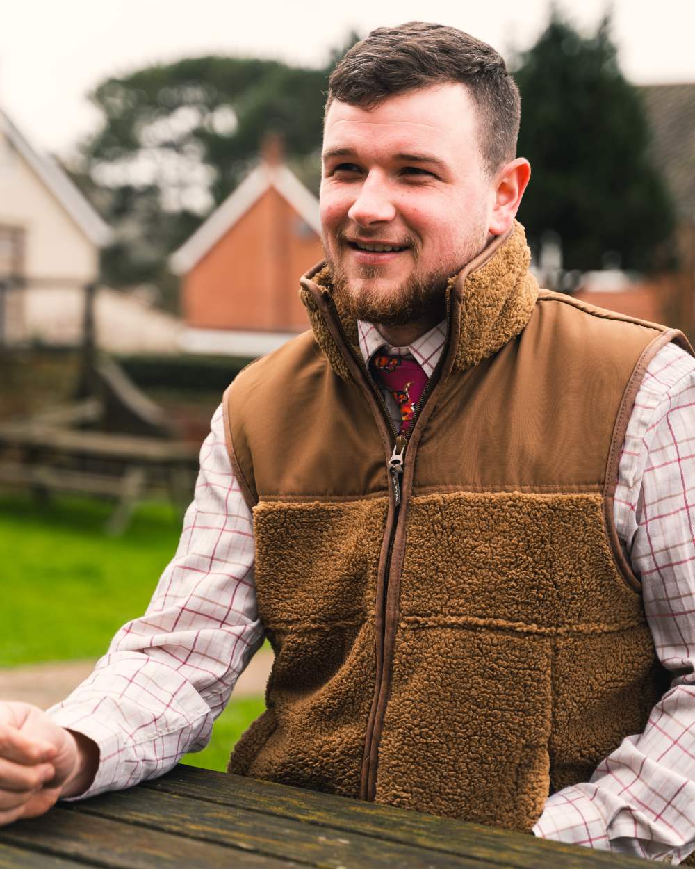 Camel coloured Jack Pyke Sherpa Fleece Gilet on house background