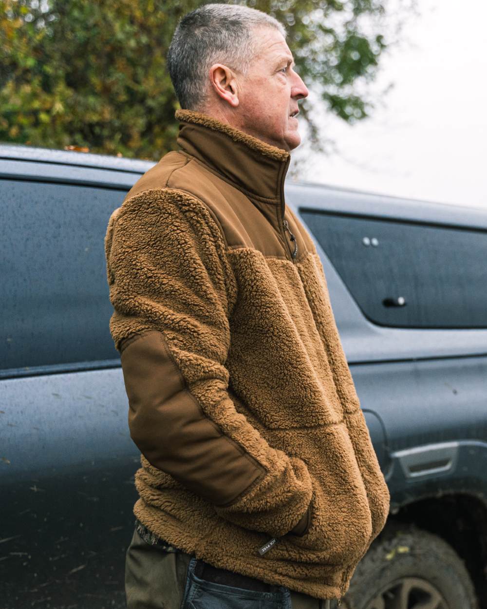 Camel coloured Jack Pyke Sherpa Fleece Jacket Gen 2 on outdoor background