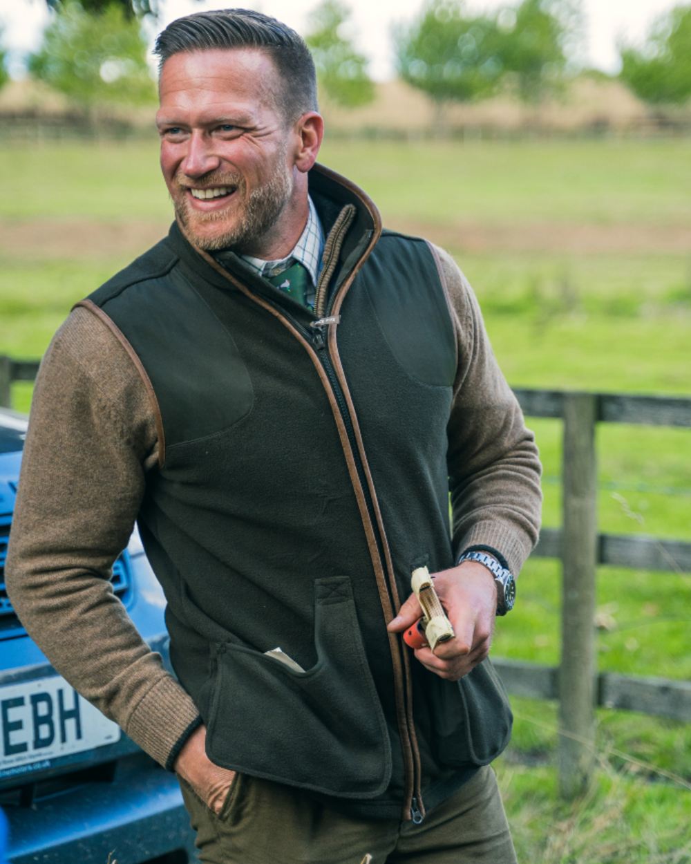 Dark Olive Jack Pyke Shooters Gilet on forest background