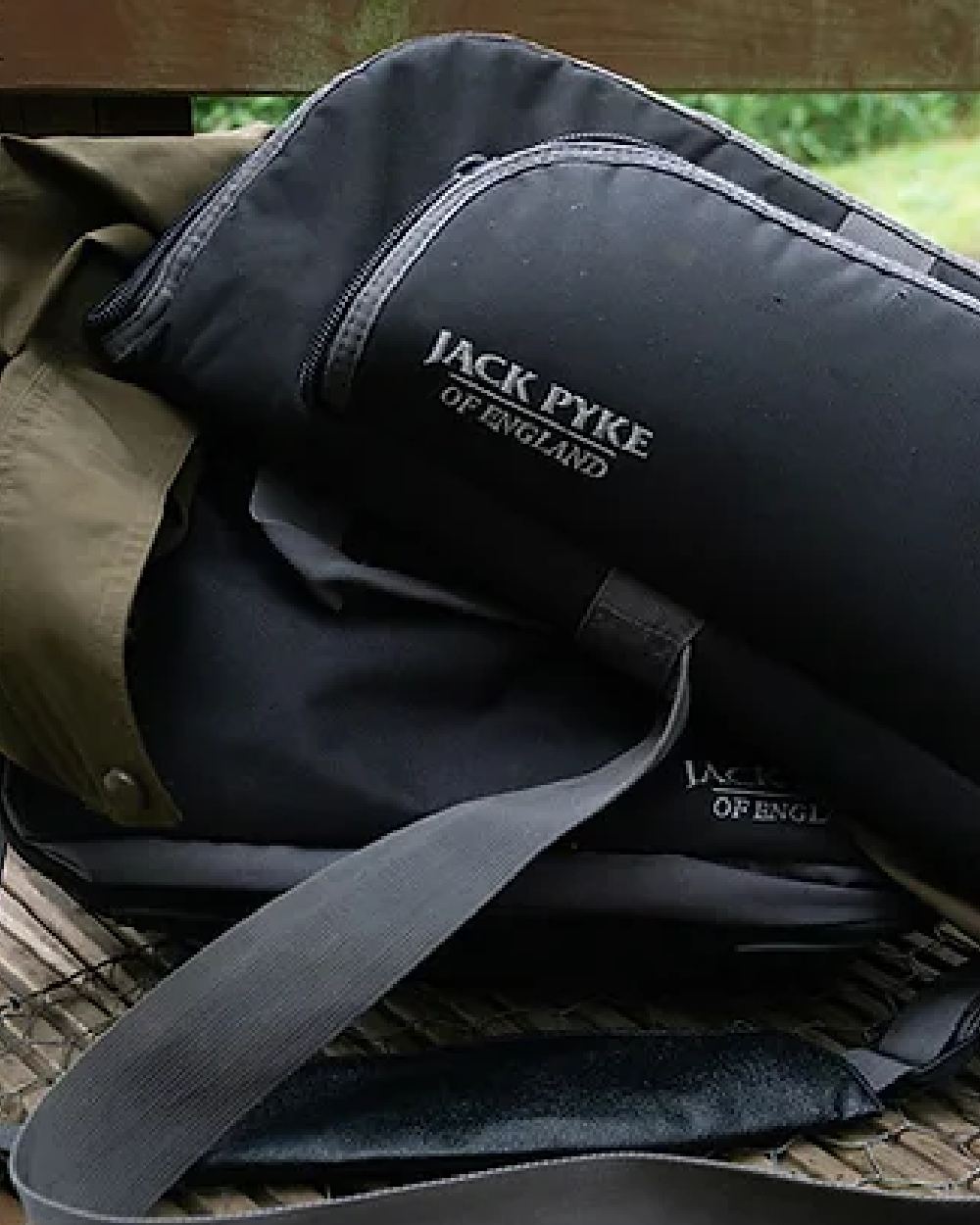 Black coloured Jack Pyke Sporting Gun Slip on wood background