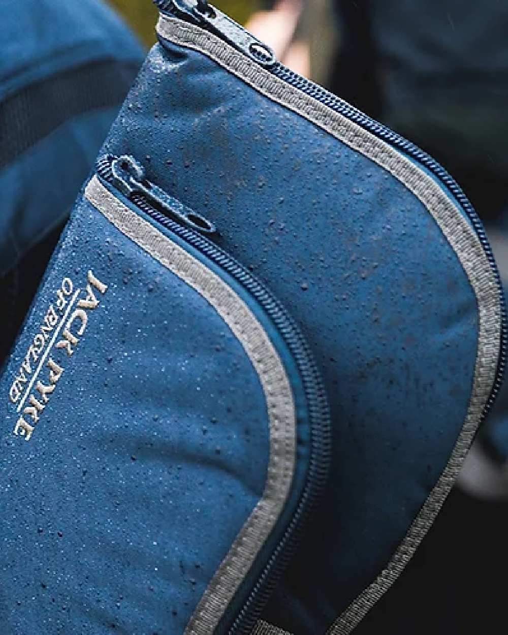 Blue coloured Jack Pyke Sporting Gun Slip on blurry background