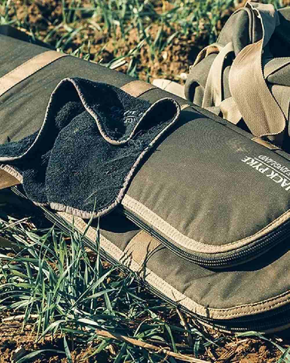 Green coloured Jack Pyke Sporting Gun Slip on grassy background