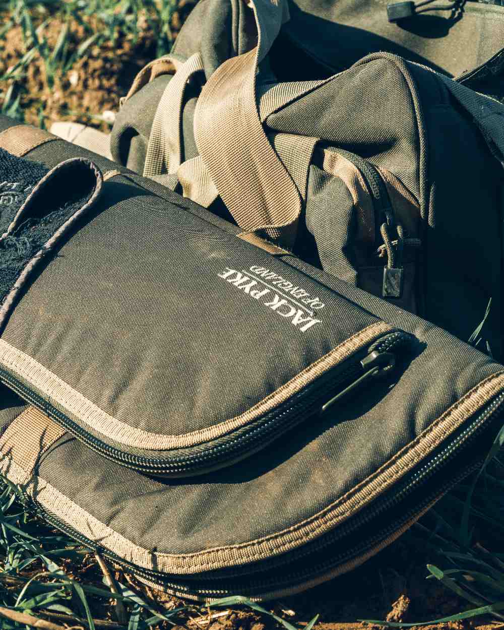 Green coloured Jack Pyke Sporting Gun Slip on forest background