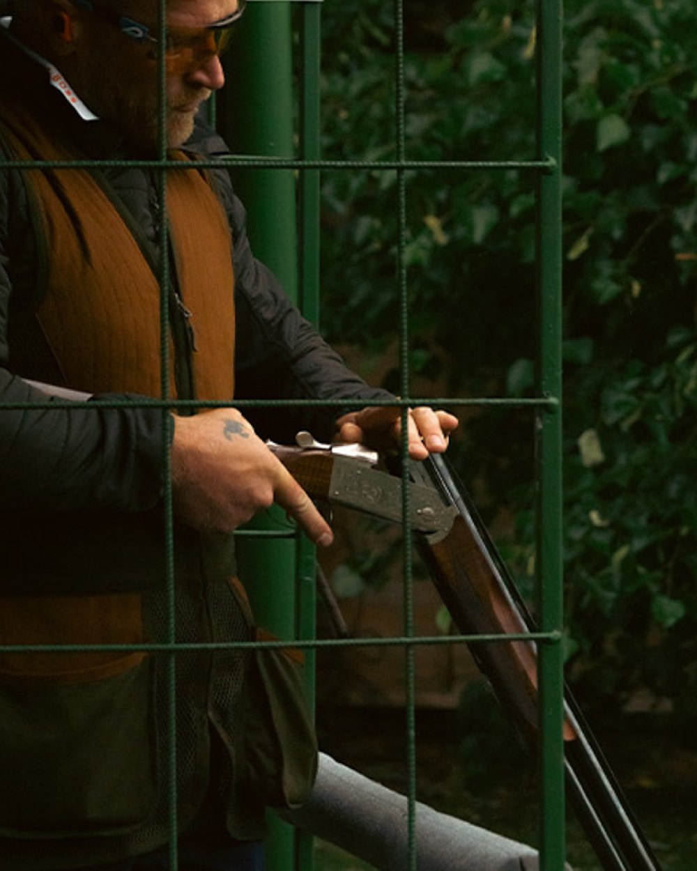 Green coloured Jack Pyke Sporting Skeet Vest on leafy background
