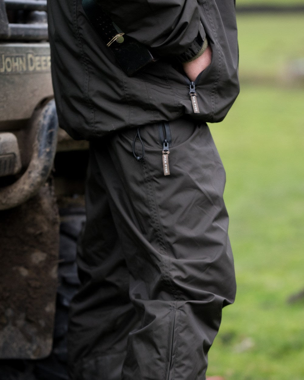 Hunters Green coloured Jack Pyke Technical Featherlite Trousers on grass background