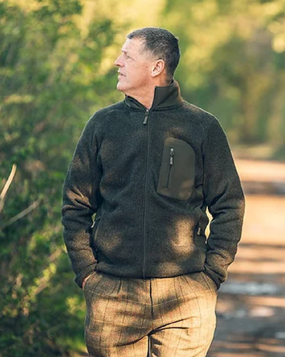 Green coloured Jack Pyke Weardale Knitted Jacket on blurry background