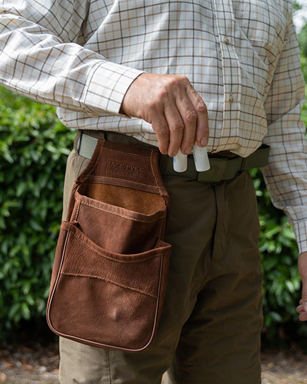 Brown coloured Jack Pyke Nubuck Cartridge Pouch on outdoor background