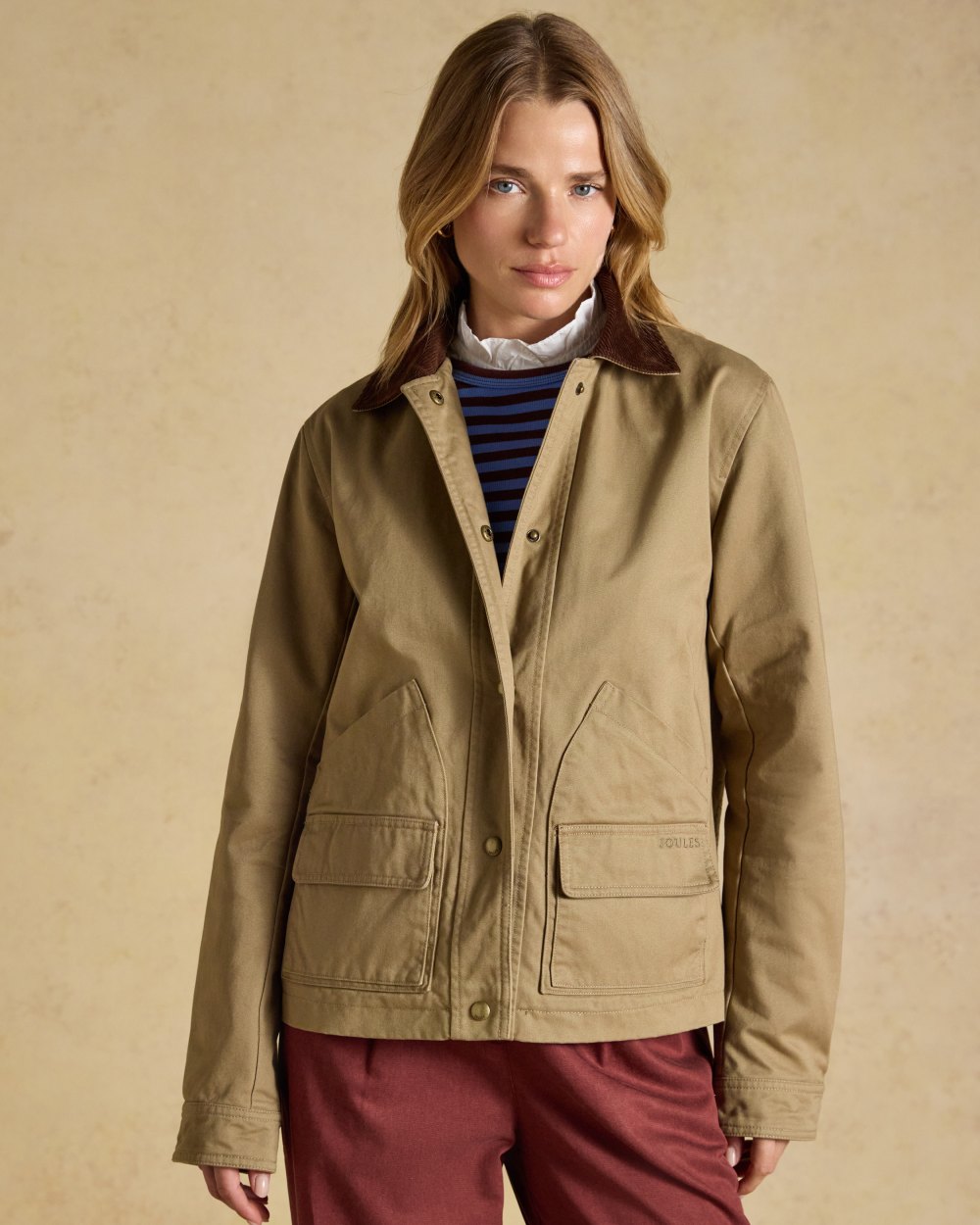 Tan Brown coloured Joules Barn Jacket on tan background