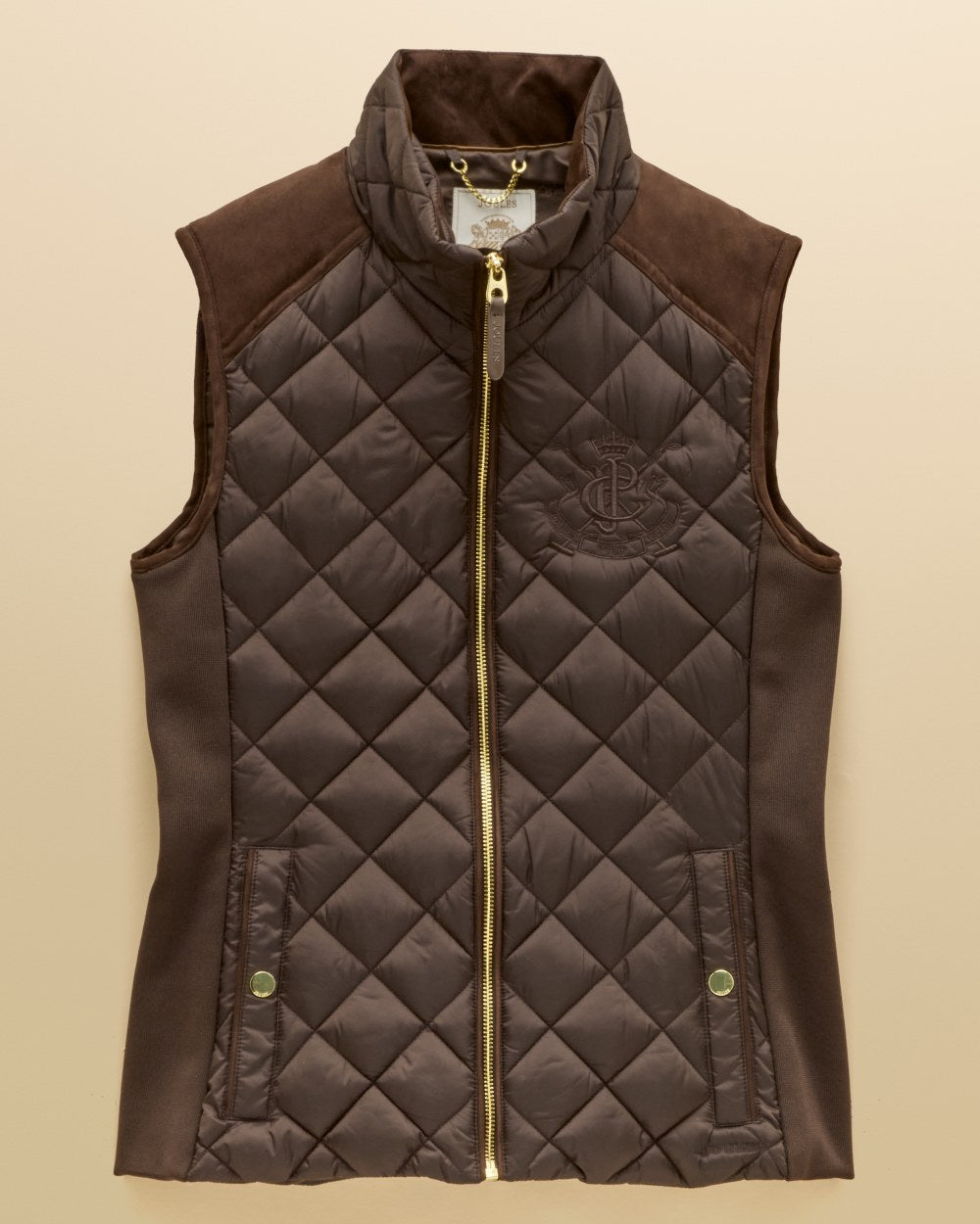 Chocolate Brown coloured Joules Braemar Luxe Gilet on tan background