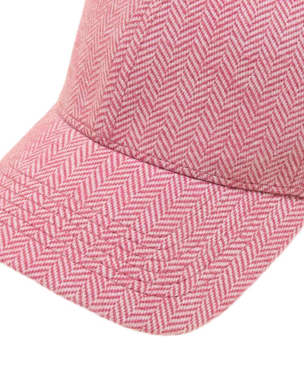 Pink coloured Joules Daley Herringbone Cap on white background