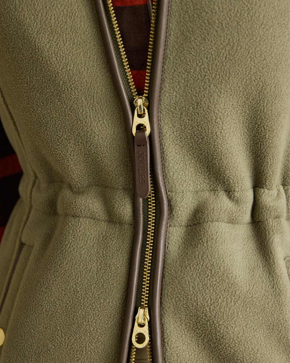 Light Green coloured Joules Heritage Longline Gilet on tan background