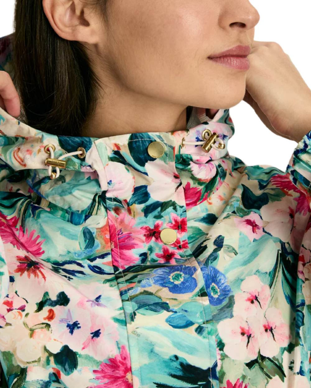 Floral coloured Joules Holkham Waterproof Packable Raincoat With Hood on white background