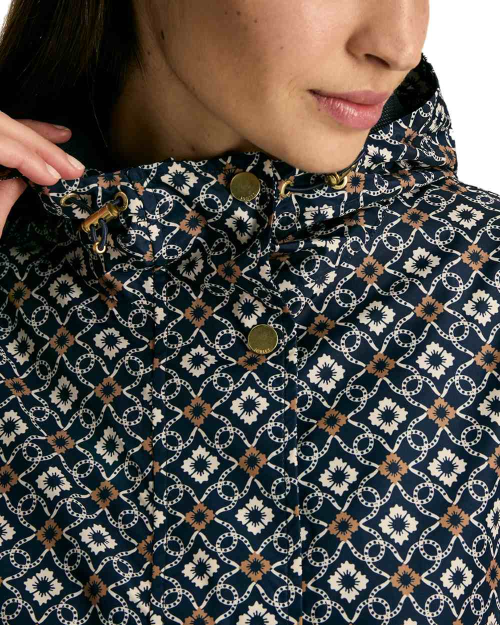 Flower Geo coloured Joules Holkham Waterproof Packable Raincoat With Hood on white background