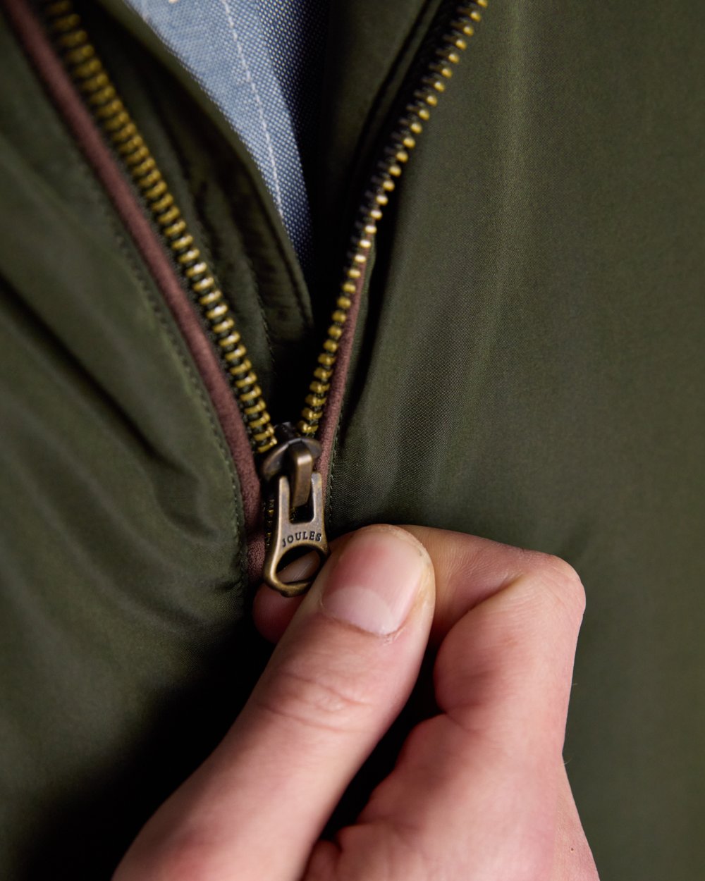 Green coloured Joules Mens Farnham Padded Fleece Lined Gilet on white background