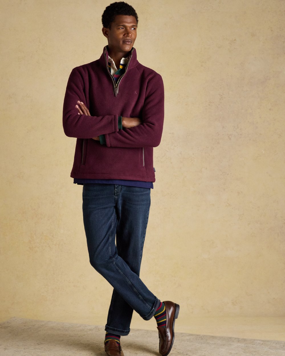 Burgundy Red Coloured Joules Mens Heritage Quarter Zip Fleece on indoor background