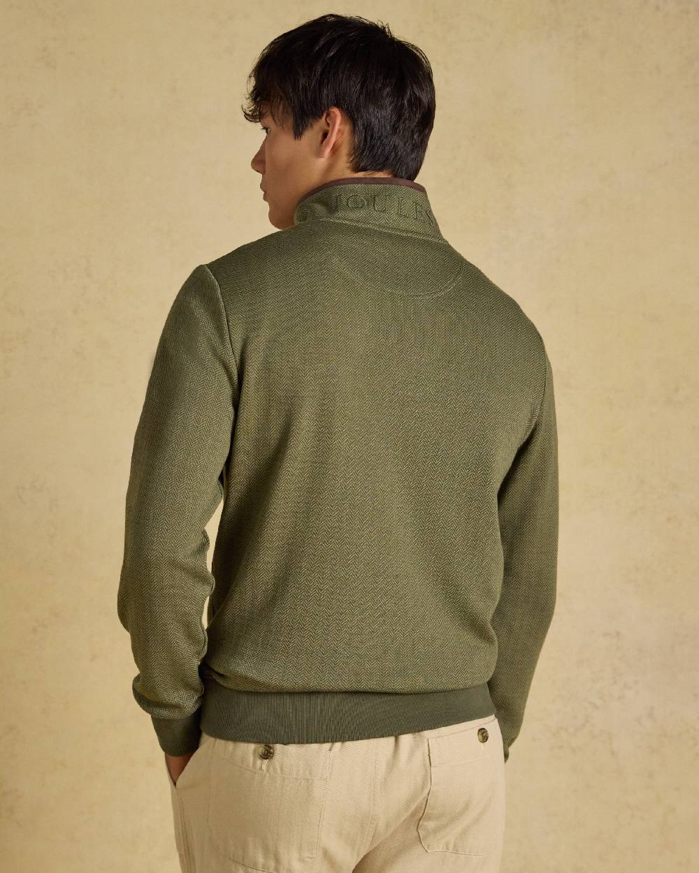 Green Coloured Joules Mens Herringbone Quarter Zip Sweatshirt on Beige Background