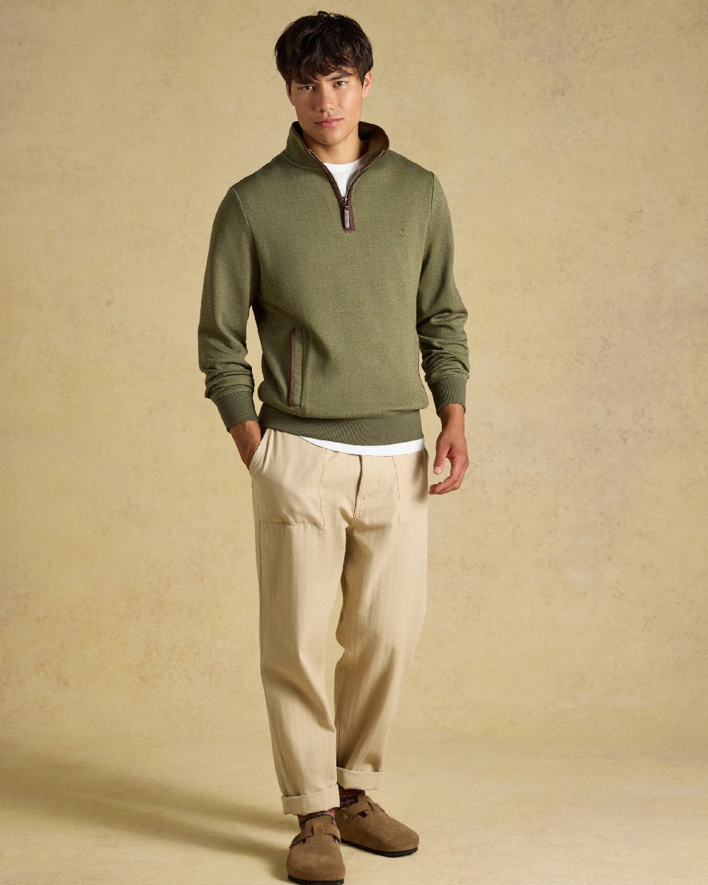 Green Coloured Joules Mens Herringbone Quarter Zip Sweatshirt on Beige Background