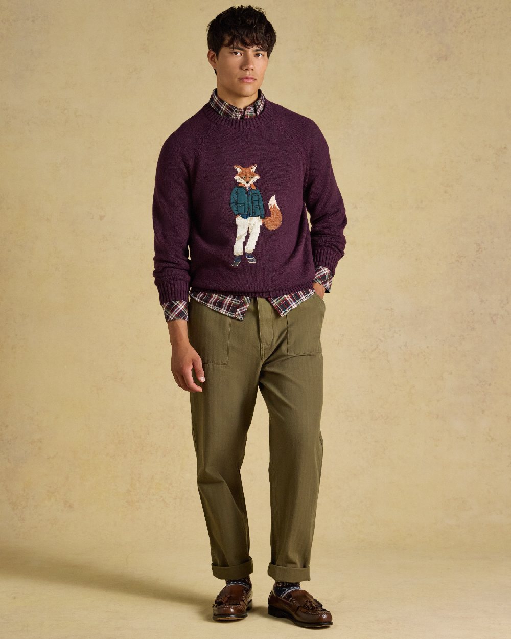 Purple Coloured Joules Mens Jonty Intarsia Crew Knit Jumper on beige background
