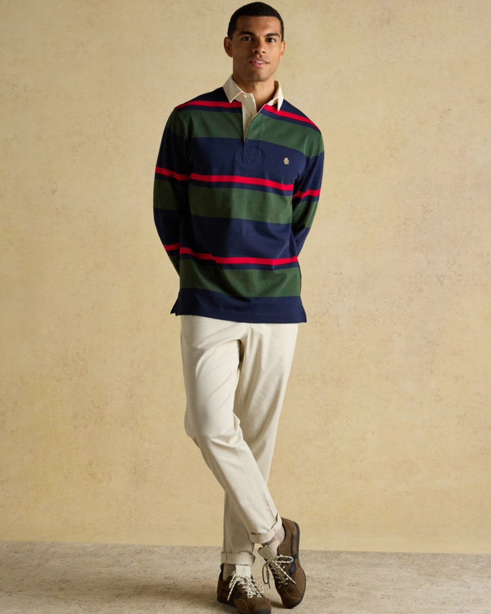 Navy Green Coloured Joules Mens Onside Rugby Shirt on wall background