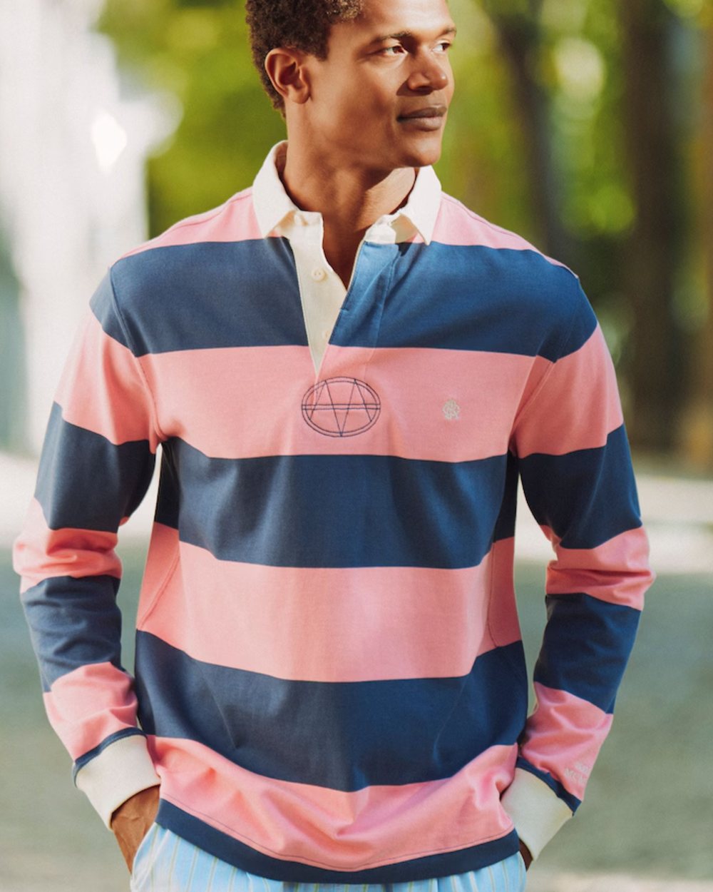 Pink Blue Coloured Joules Mens Onside Rugby Shirt on outdoor background