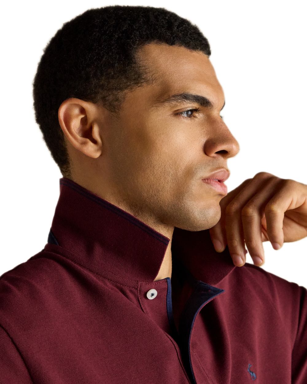 Burgundy coloured Joules Mens Woody Cotton Pique Polo Shirt on white background