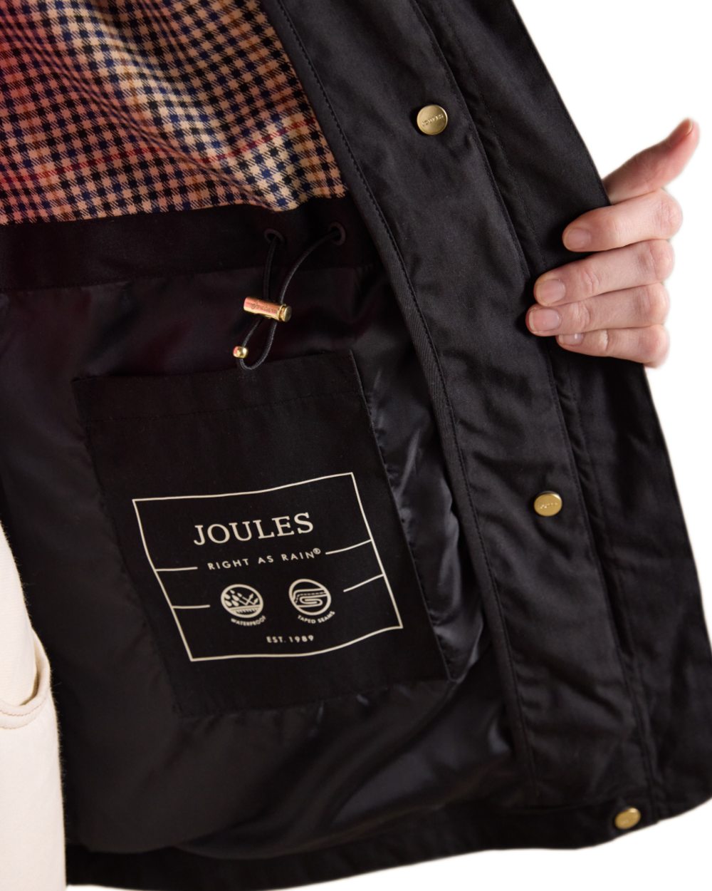 Black Coloured Joules Portwell Waterproof Raincoat With Hood On A White Background