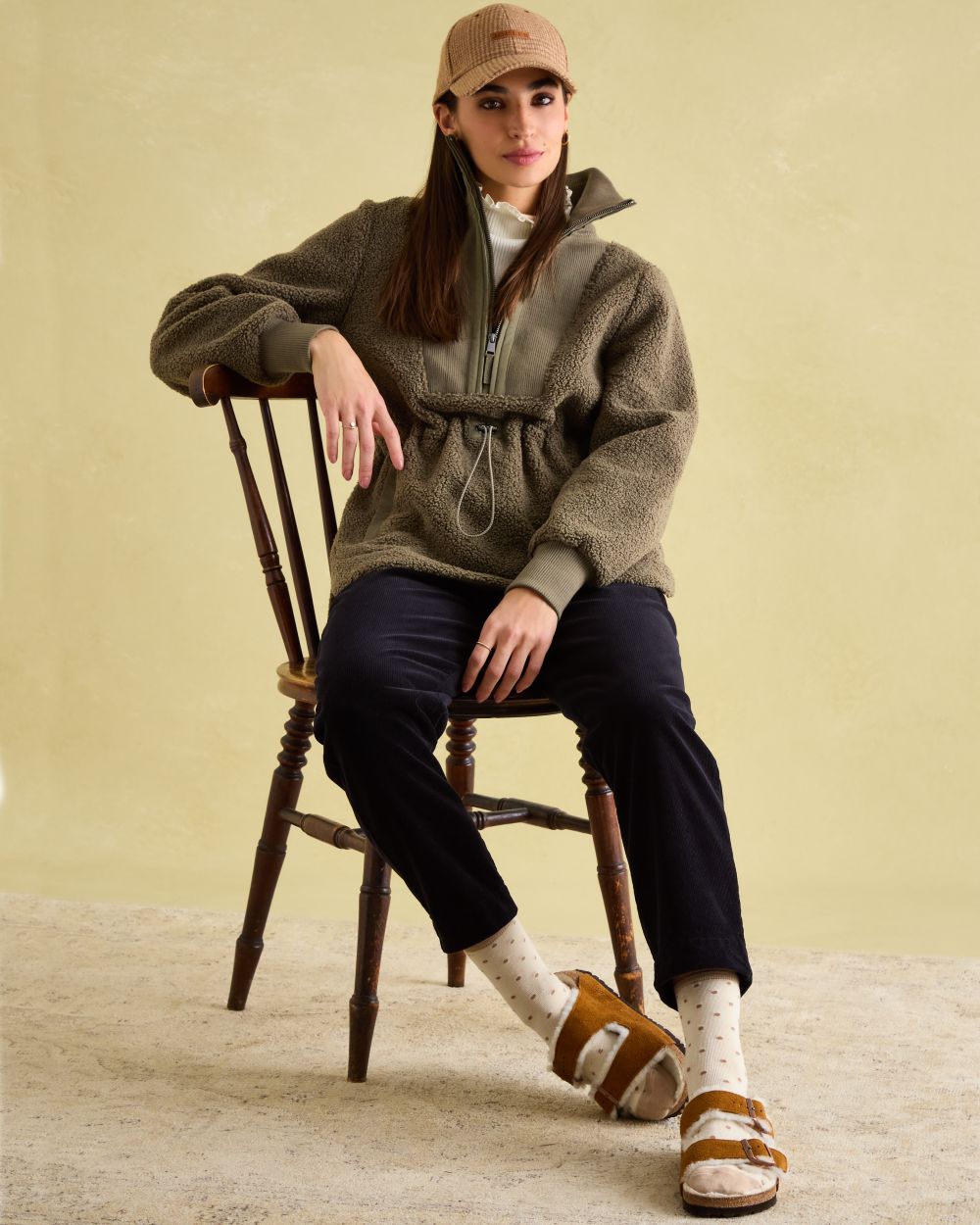 Khaki Green coloured Joules Womens Thurleston Borg Fleece Jacket on wall Background