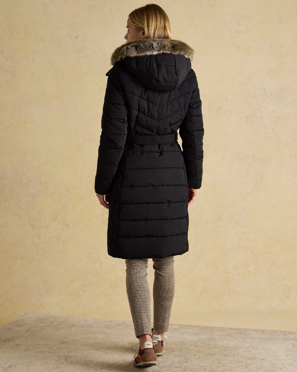 Black Coloured Joules Womens Aspen Long Showerproof Padded Coat on indoor background