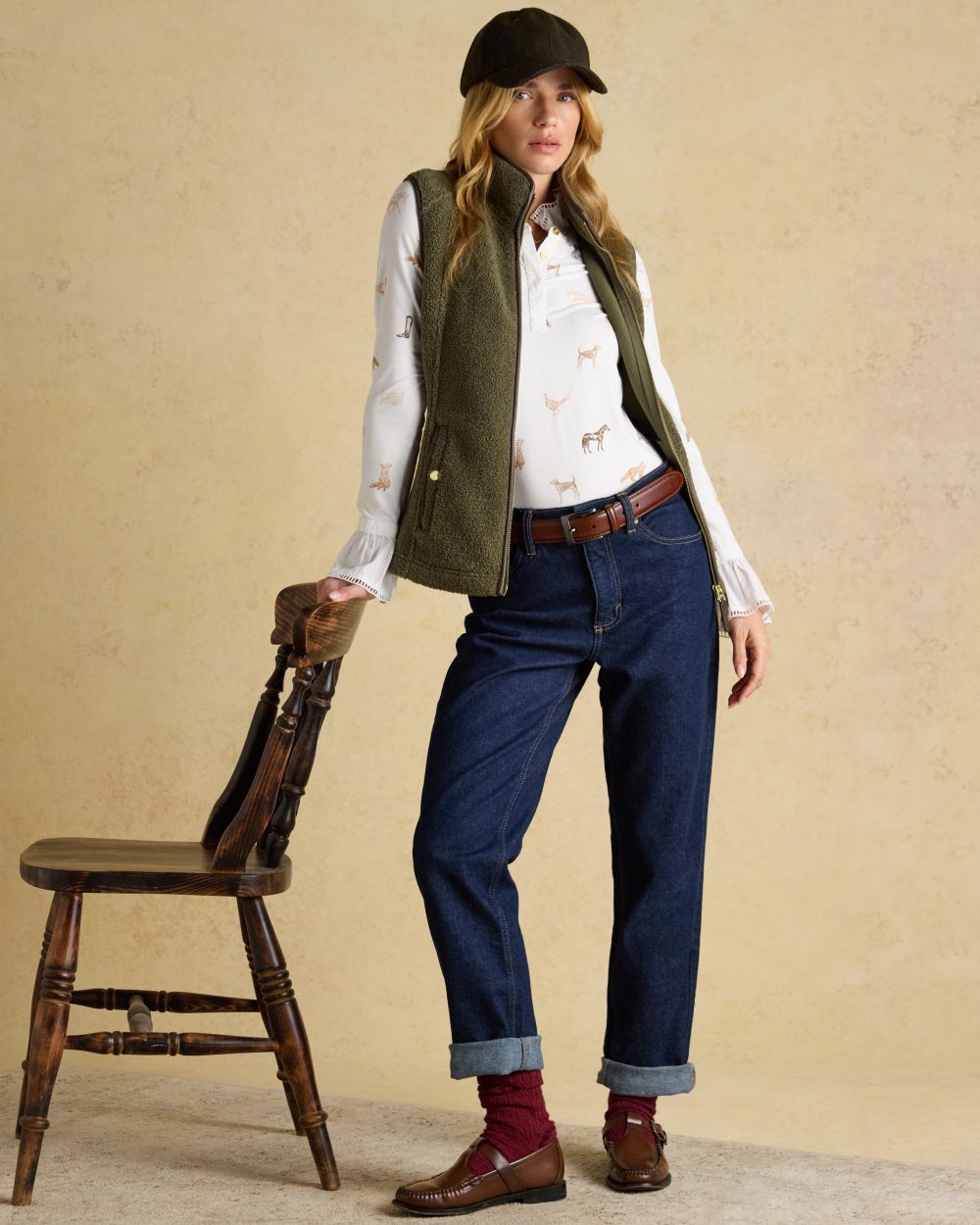 Khaki Green coloured Joules Womens Borg Heritage Fleece Gilet on wall background
