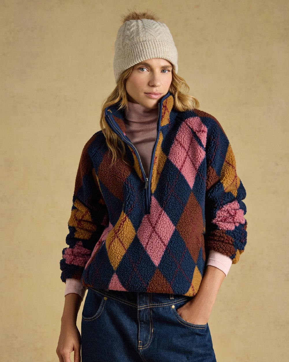 Oatmeal Coloured Joules Womens Cable Bobble Hat on Cream Background