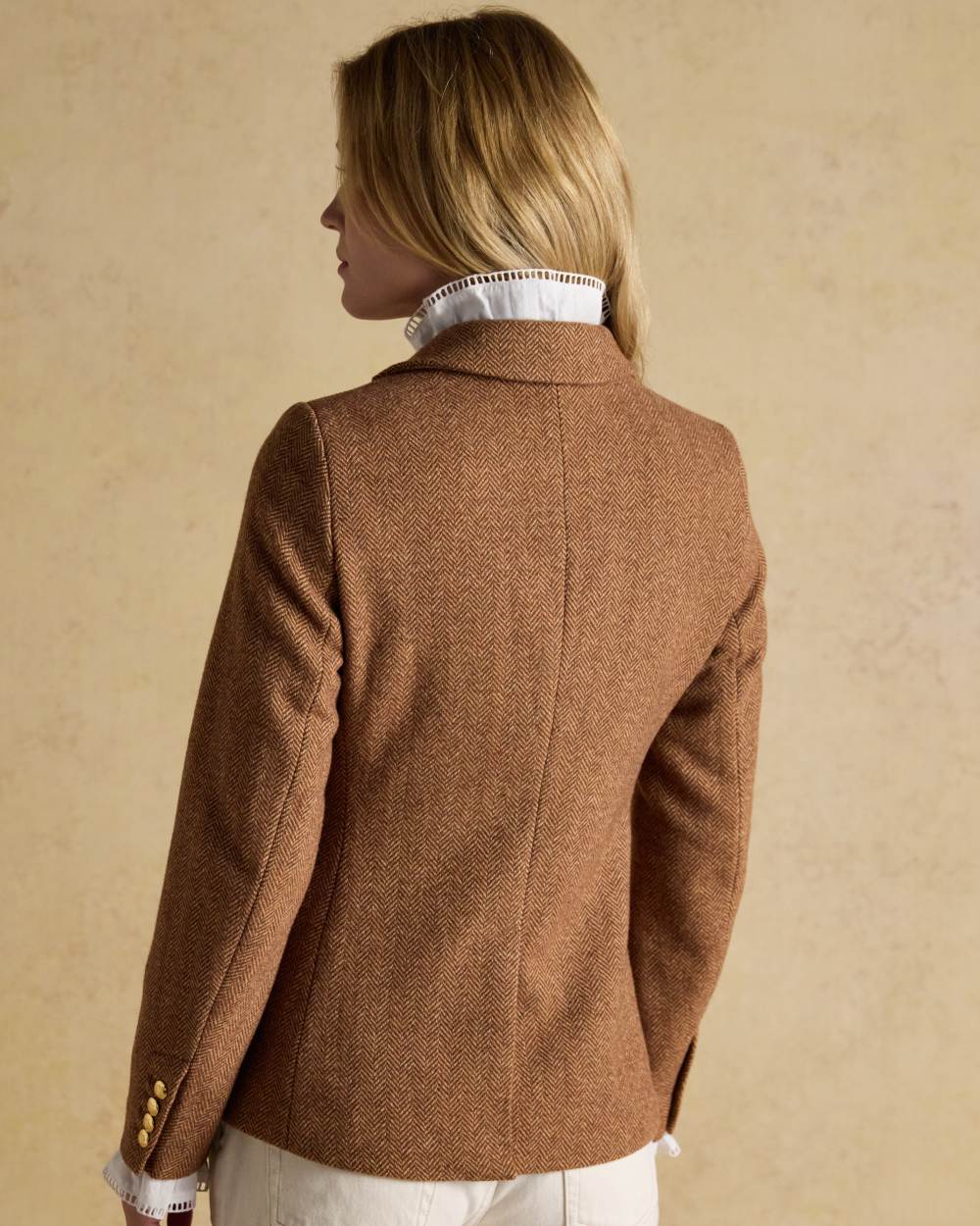 Brown Herringbone coloured Joules Womens Canterly Tweed Hacking Jacket on wall background