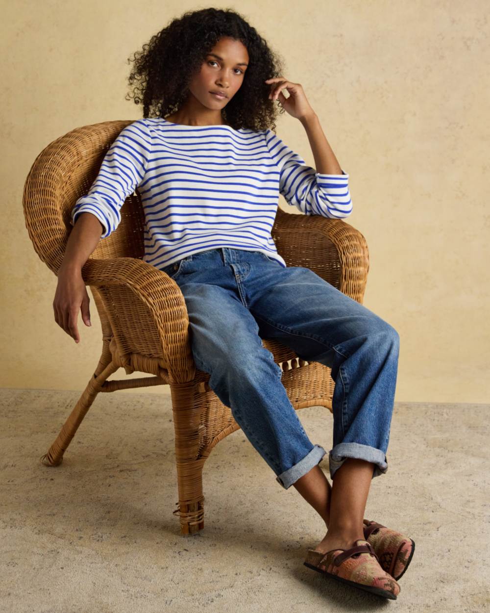 Blue Stripe coloured Joules Womens Harbour Long Sleeve Striped Boat Neck Breton Top on wall background
