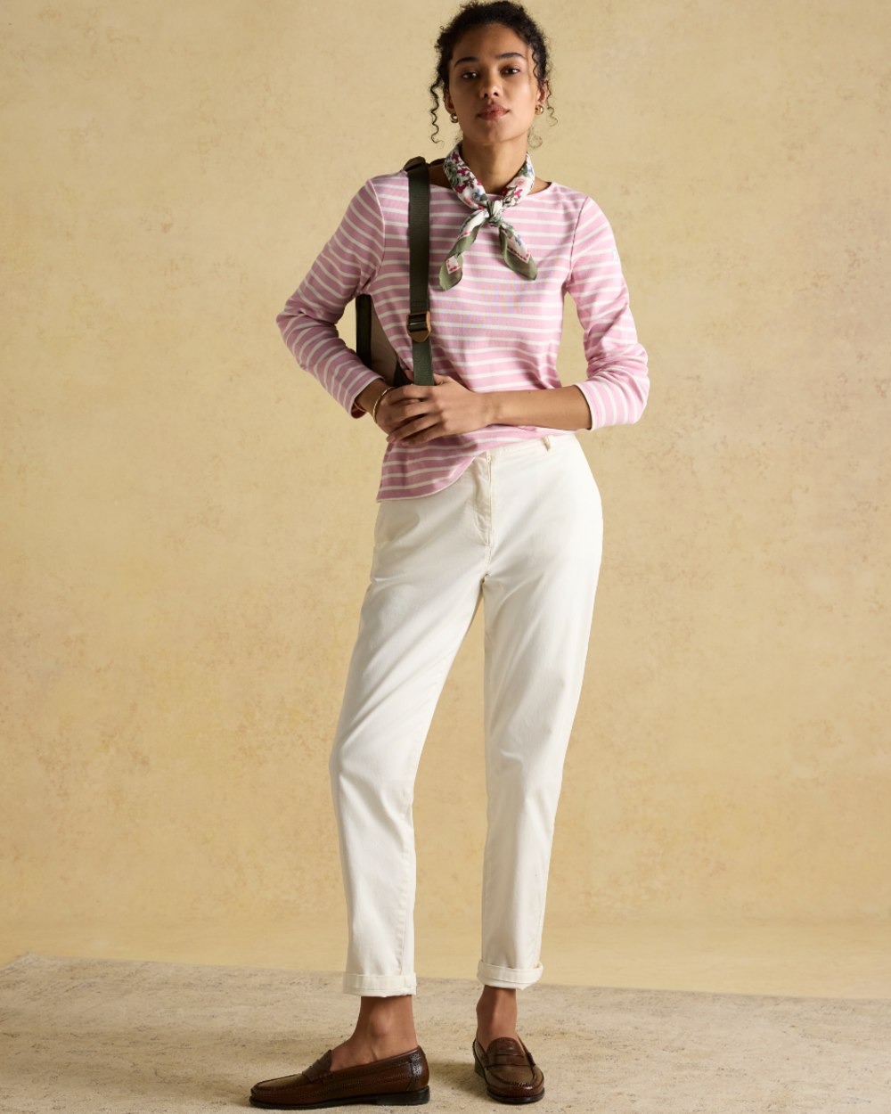 Pink Stripe coloured Joules Womens Harbour Long Sleeve Striped Boat Neck Breton Top on wall background