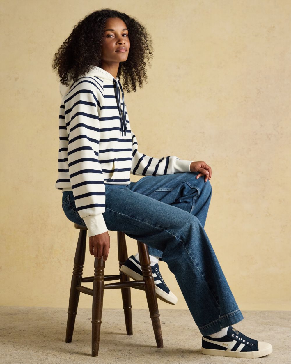 Cream Navy Stripe coloured Joules Womens Milbourne Hoodie on wall background