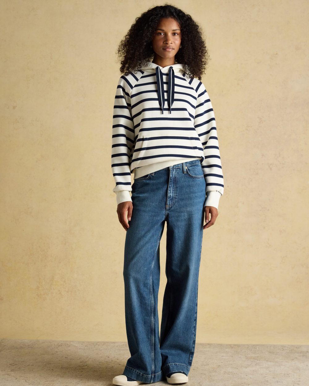 Cream Navy Stripe coloured Joules Womens Milbourne Hoodie on wall background