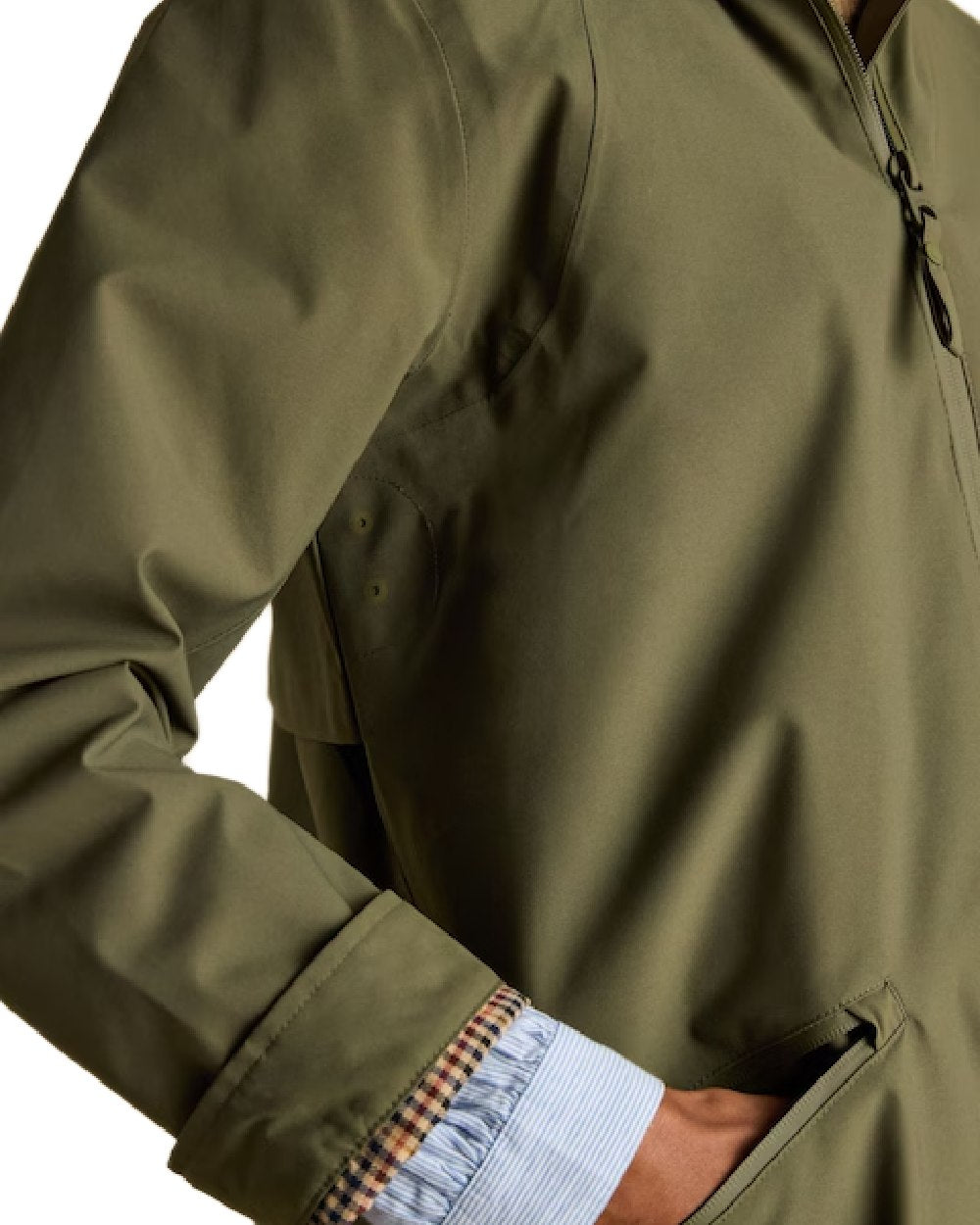 Green Grapeleaf Coloured Joules Womens Rainaway Waterproof Longline Raincoat on white background