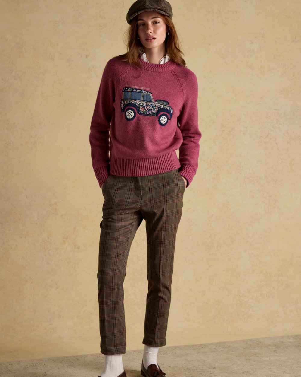 Pink coloured Joules Womens Rutland Intarsia Cotton Rich Knitted Jumper on wall background