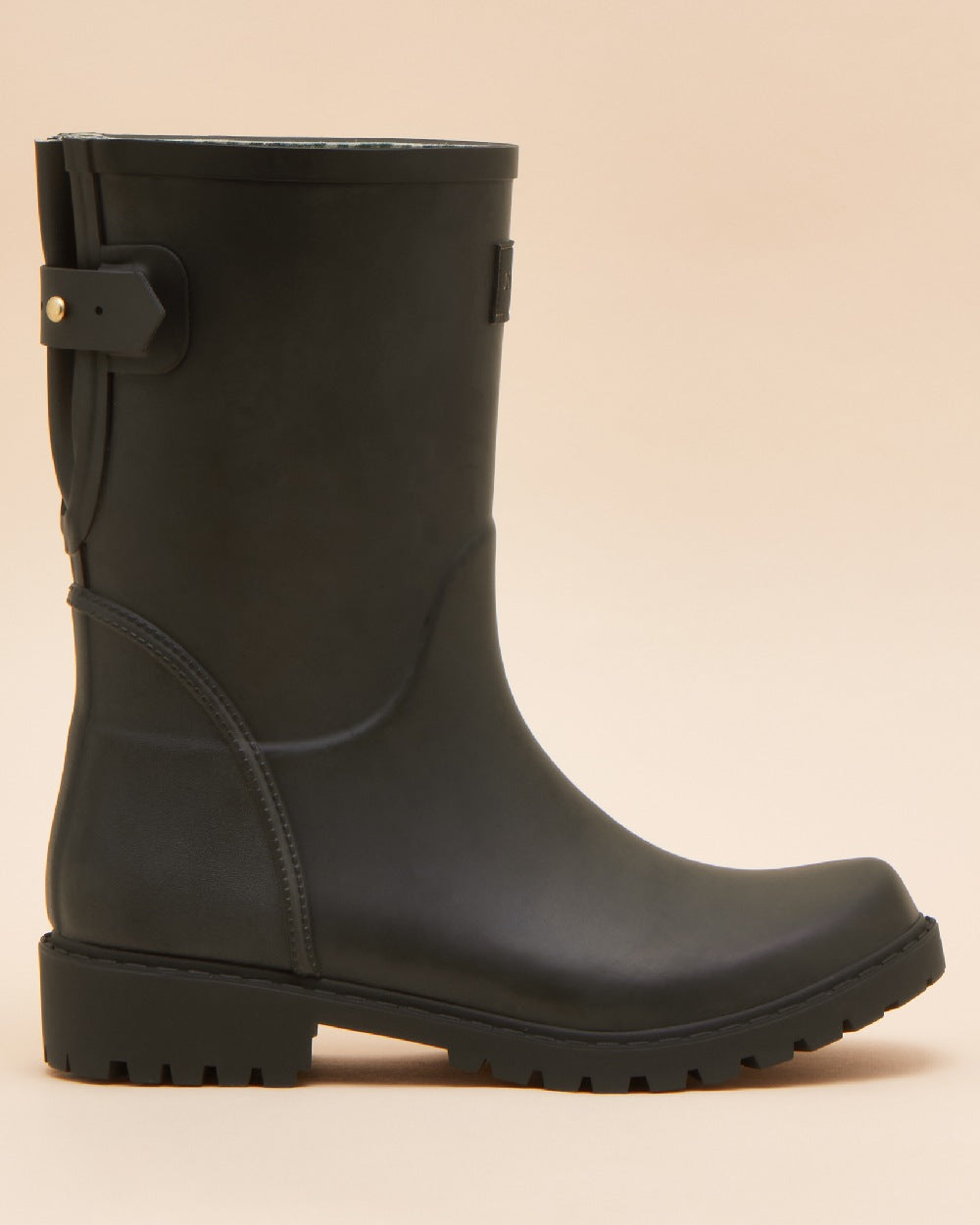 Black coloured Joules Womens Wistow Adjustable Mid Calf Wellies on tan background