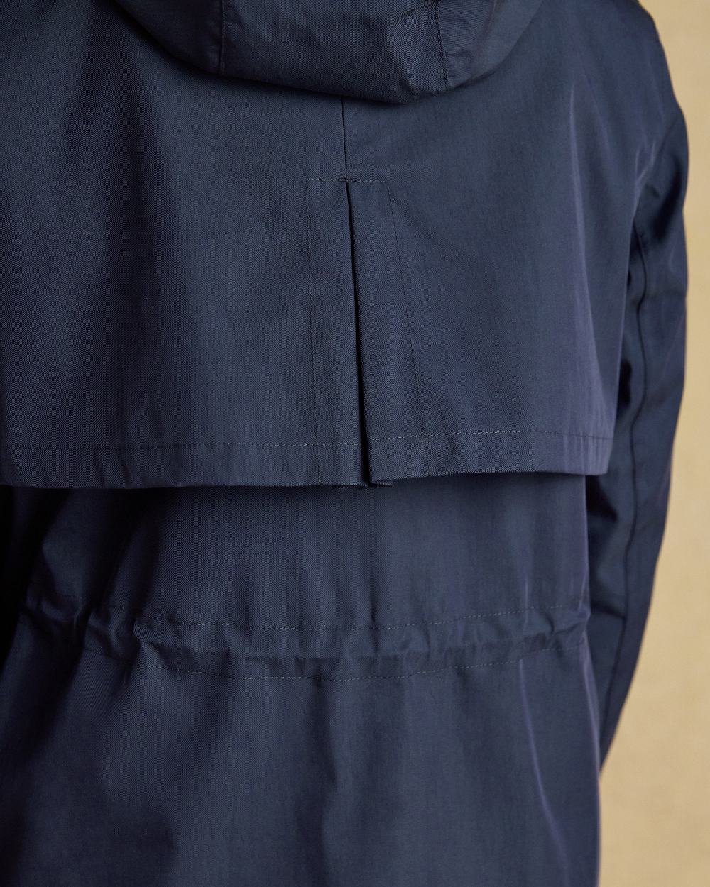 Navy Coloured Joules Portwell Waterproof Raincoat With Hood On A White Background