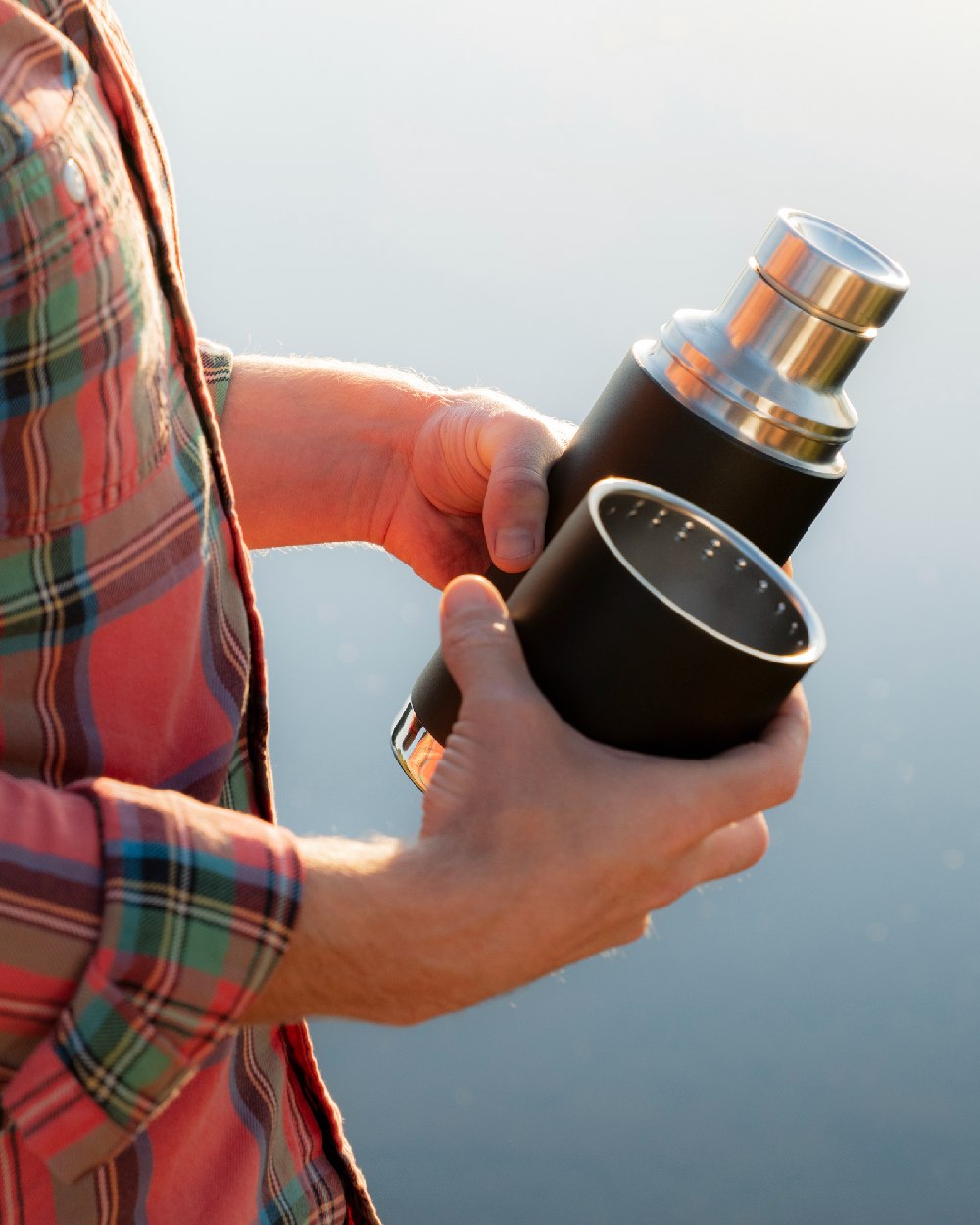 Black coloured Klean Kanteen Insulated TKPro Flask on sky background