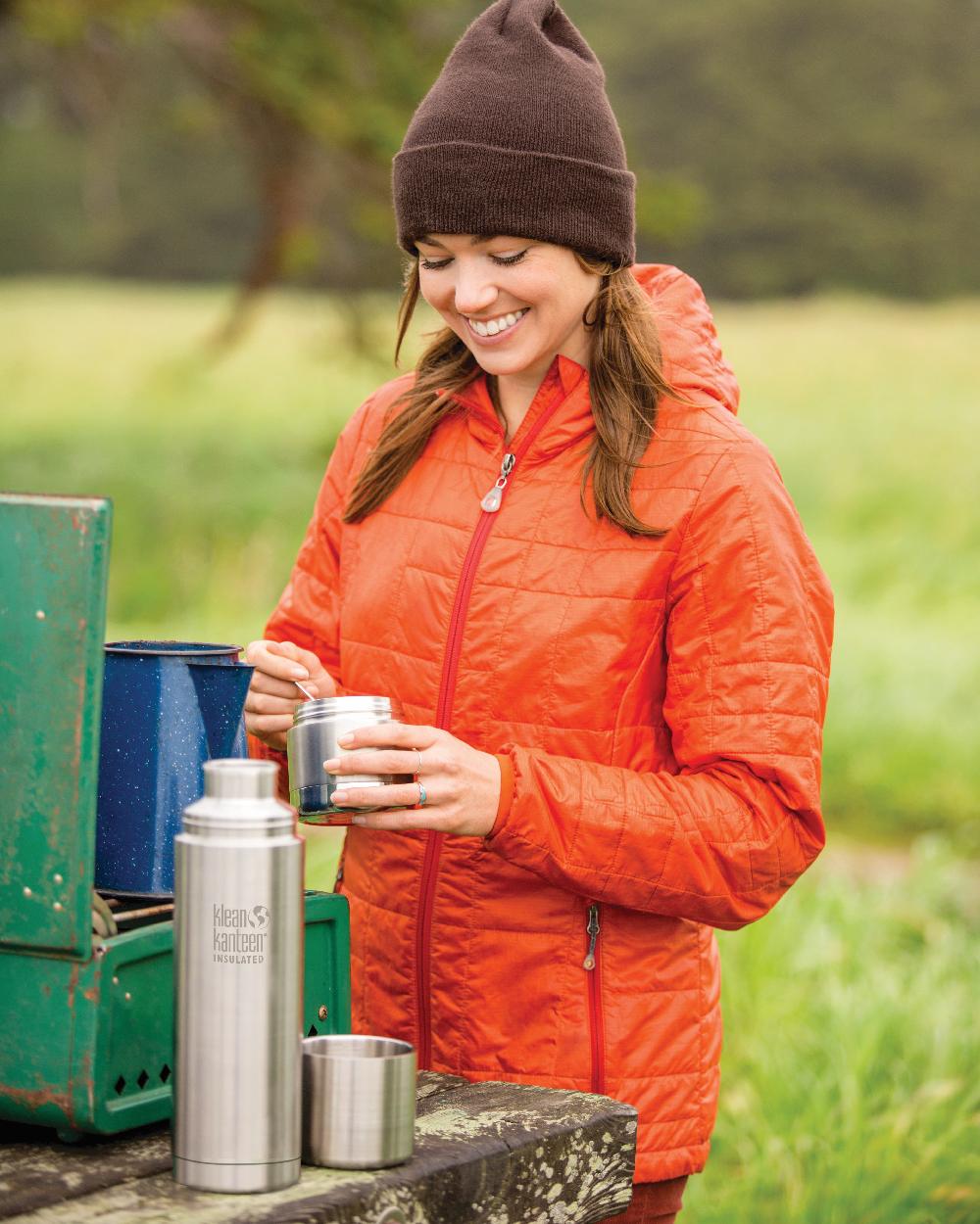 Brushed Stainless coloured Klean Kanteen Insulated TKPro Flask on forest background