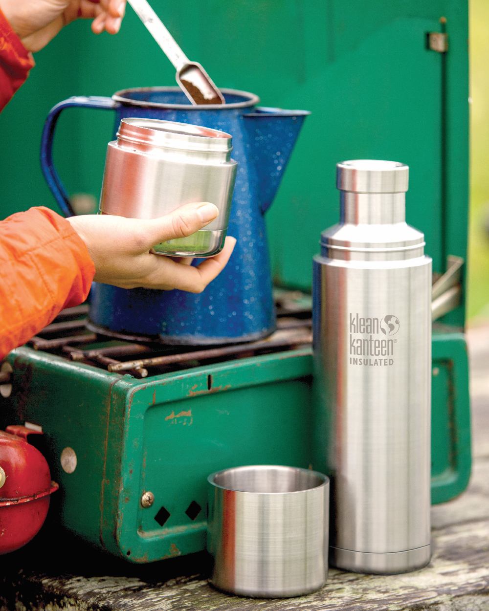 Brushed Stainless coloured Klean Kanteen Insulated TKPro Flask on forest background