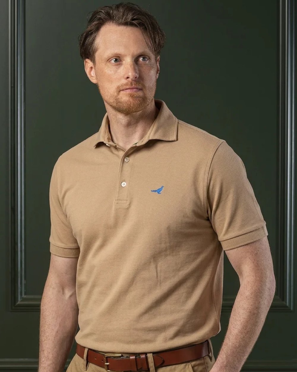 Camel coloured Laksen Mens Amalfi Polo T-Shirt on wall background
