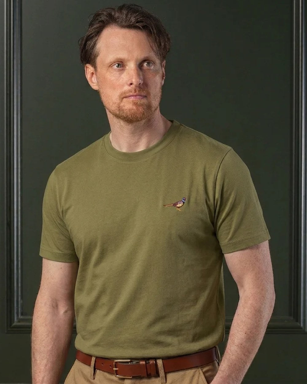 Olive coloured Laksen Mens Pheasant Cotton T-Shirt on wall background