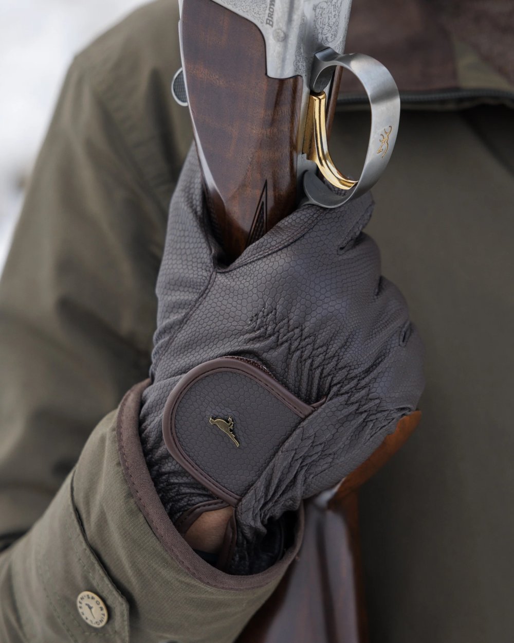 Olive coloured Laksen Mens Ultra Grip Shooting Gloves on forest background