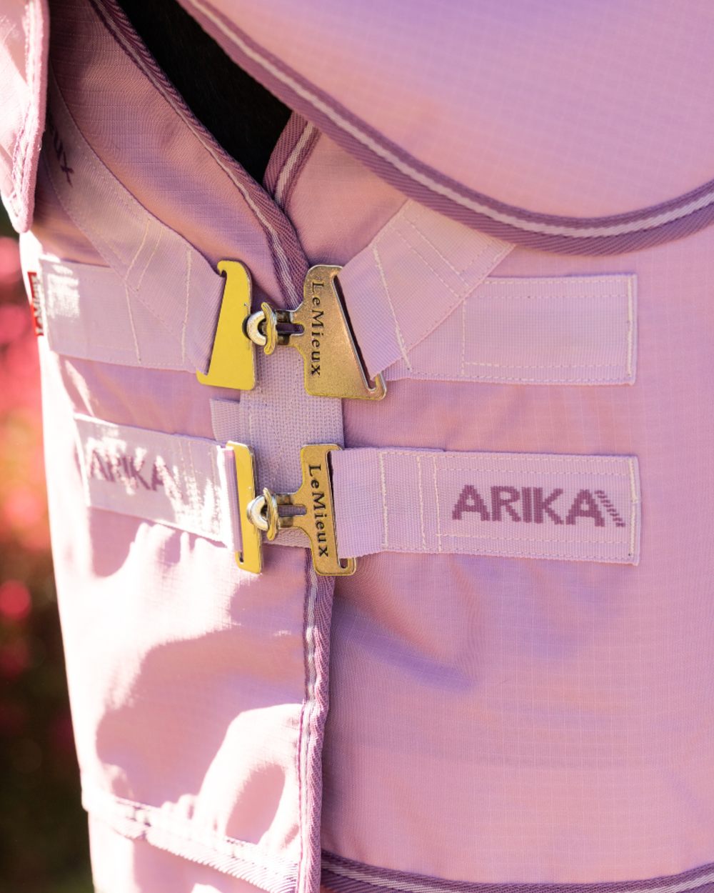 Fondant coloured LeMieux Arika Ripstop 50g Turnout Horse Rug on outdoor background