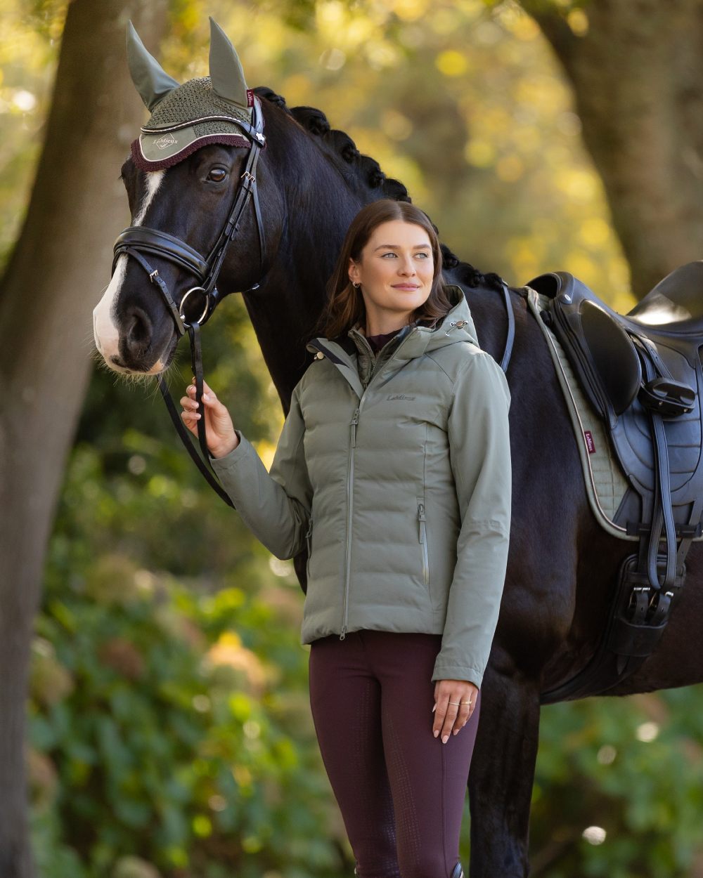 Rosemary coloured LeMieux Brooke Waterproof Hybrid Jacket on tree background
