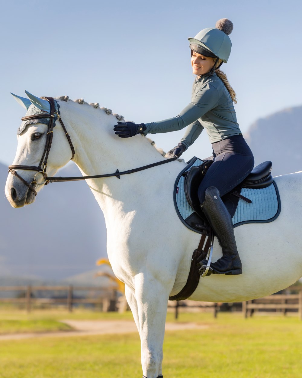 Glacier coloured LeMieux Casey Hat Silk on barn background